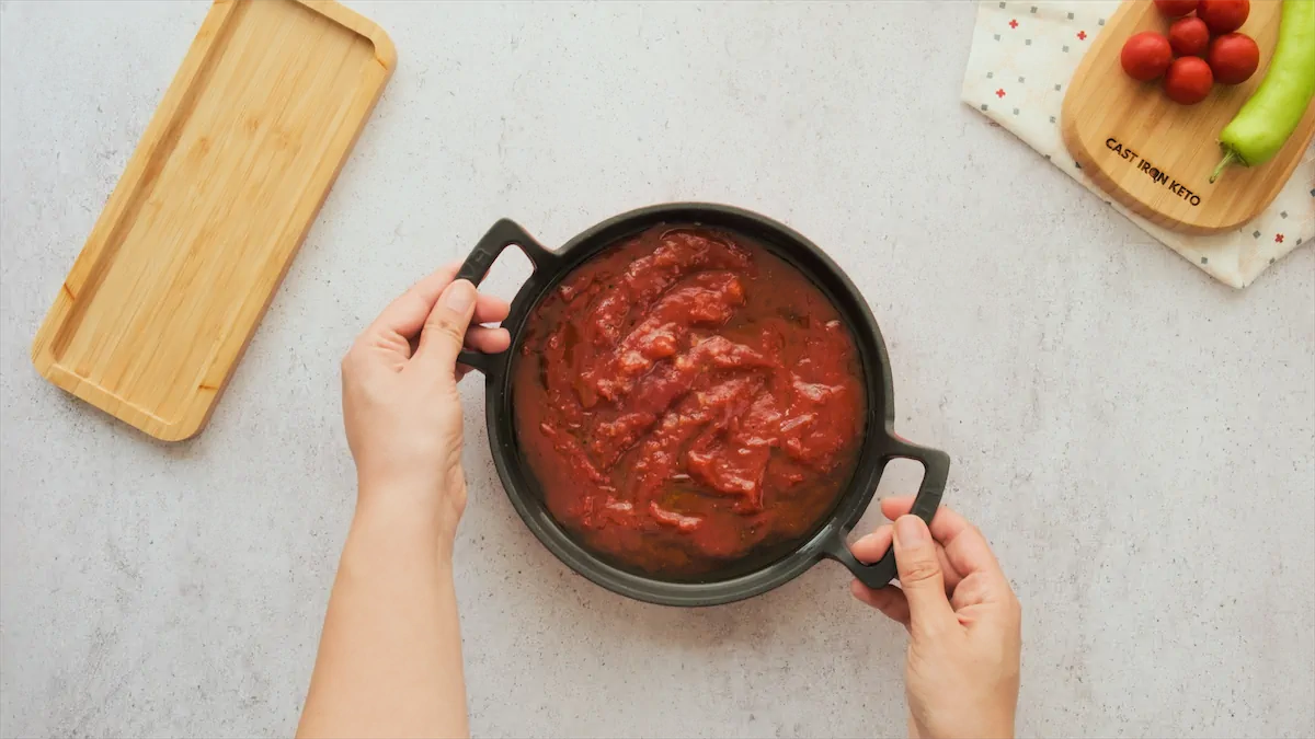 Tomato sauce in a cast iron skillet.