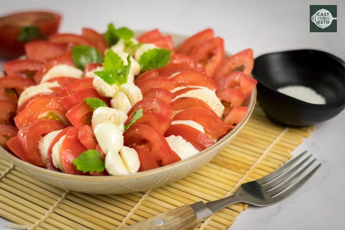 Keto salad recipe made with tomatoes and mozzarella Cheese.
