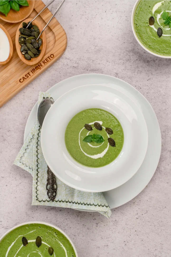 Keto Cucumber Gazpacho on a serving bowl garnished with pumpkin seeds.