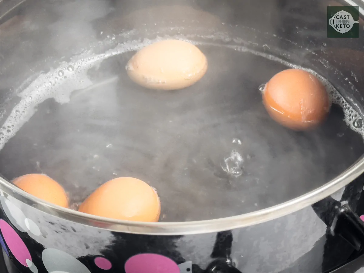 Boiling eggs in a pot.