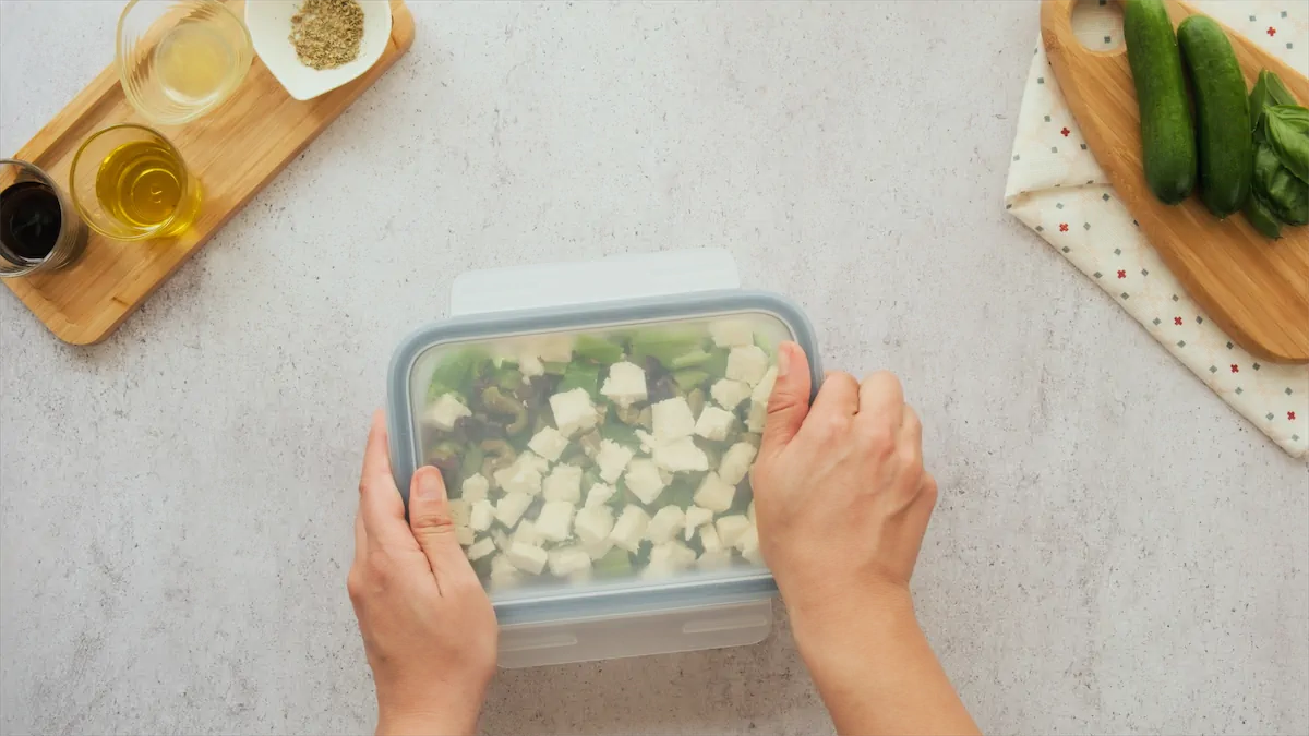 Storing a box of keto greek salad.
