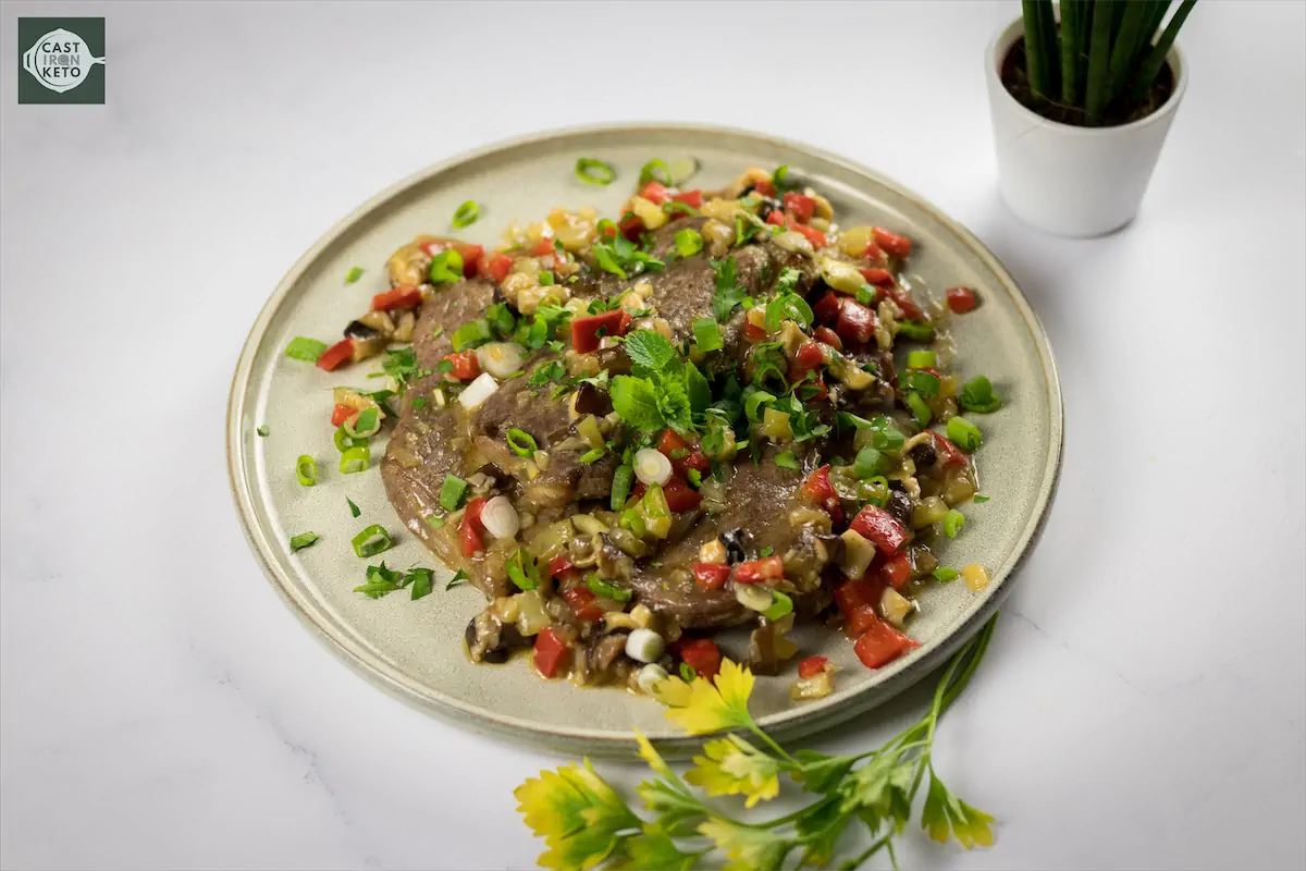 Steak recipe with toppings on a plate