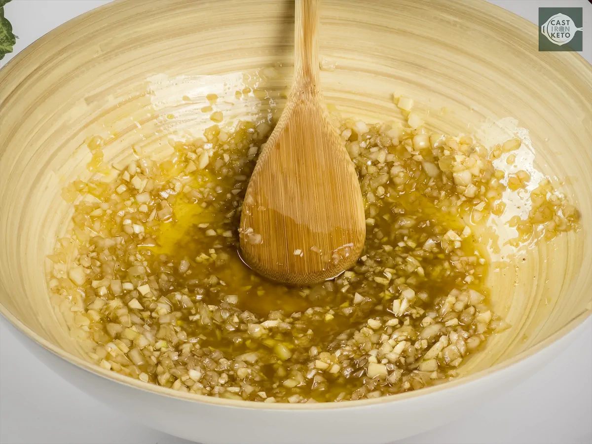 Mixing the marinade ingredients with a wooden spatula.
