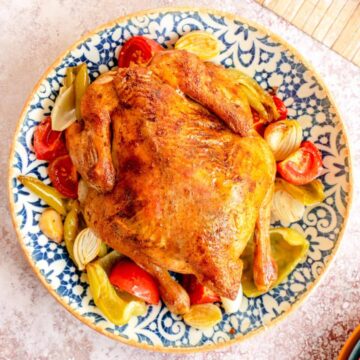 Whole roasted chicken with vegetables.