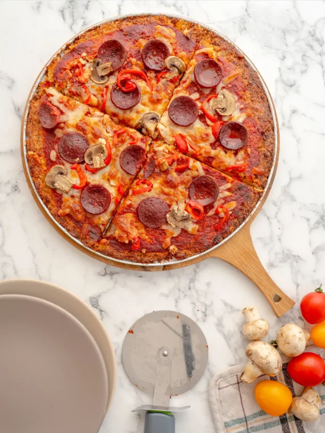 Keto pizza sliced and served.