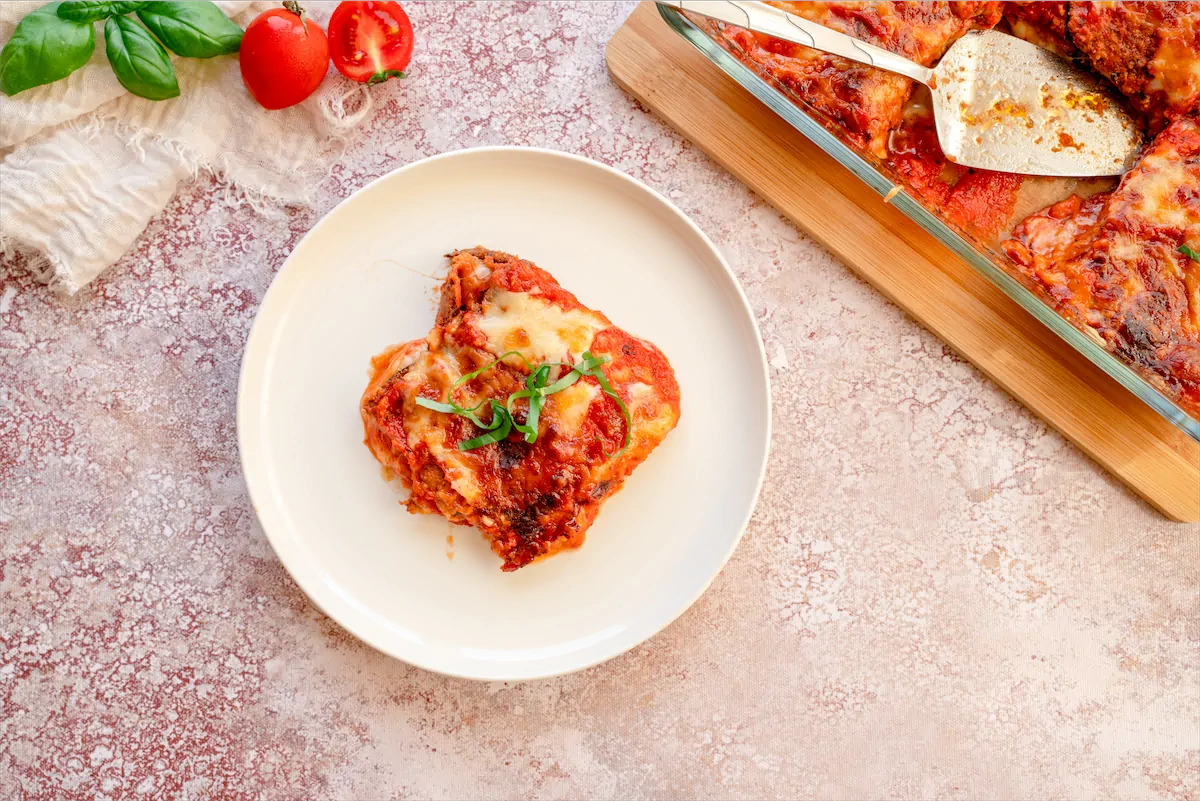 A portion of eggplant parmesan recipe served on a plate.
