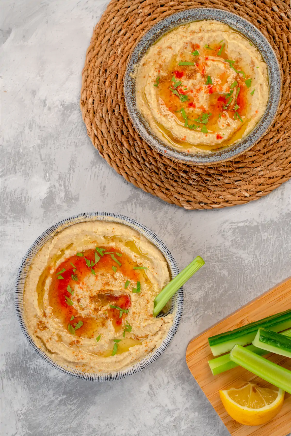 Hummus served in two bowls.