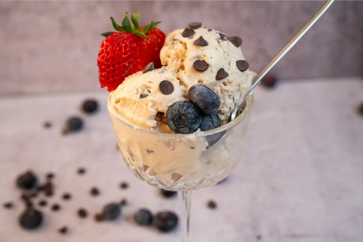 Peanut butter ice cream with chocolate chips and berries.