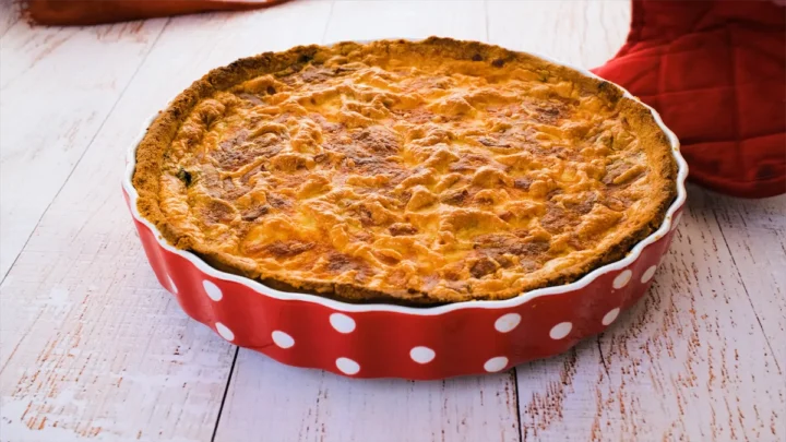Baked spinach quiche on a baking dish.