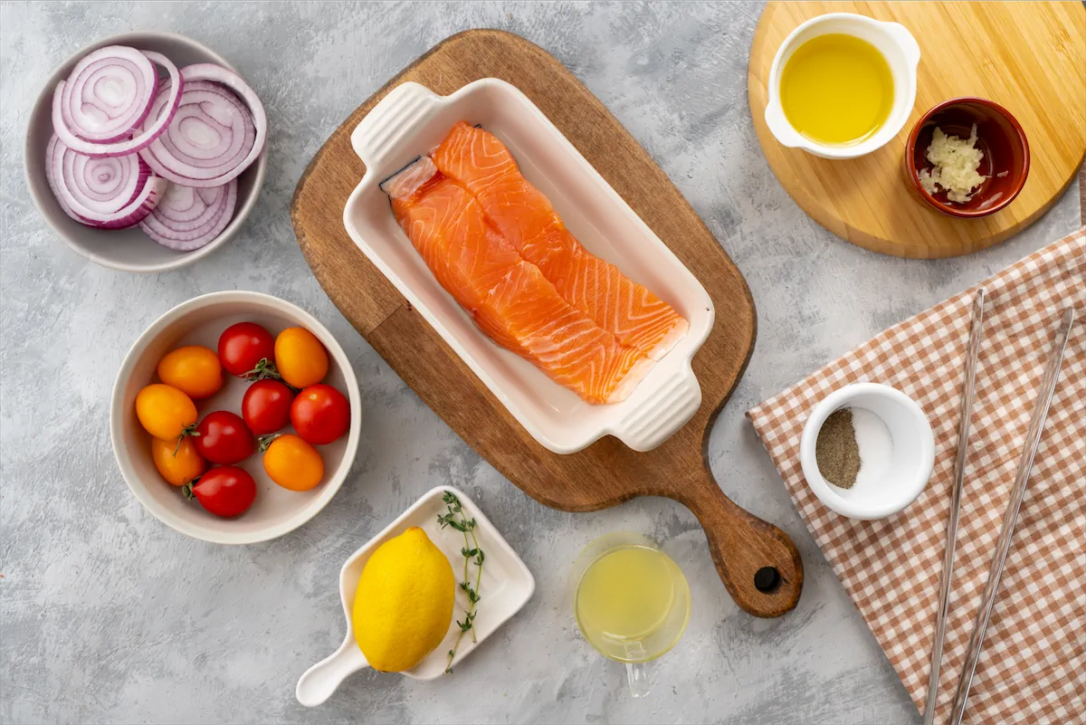 Ingredients prepared on the table for the preparation of baked salmon recipe.