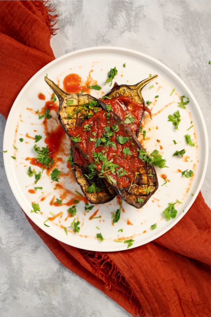 Roasted eggplant recipe served on a plate.