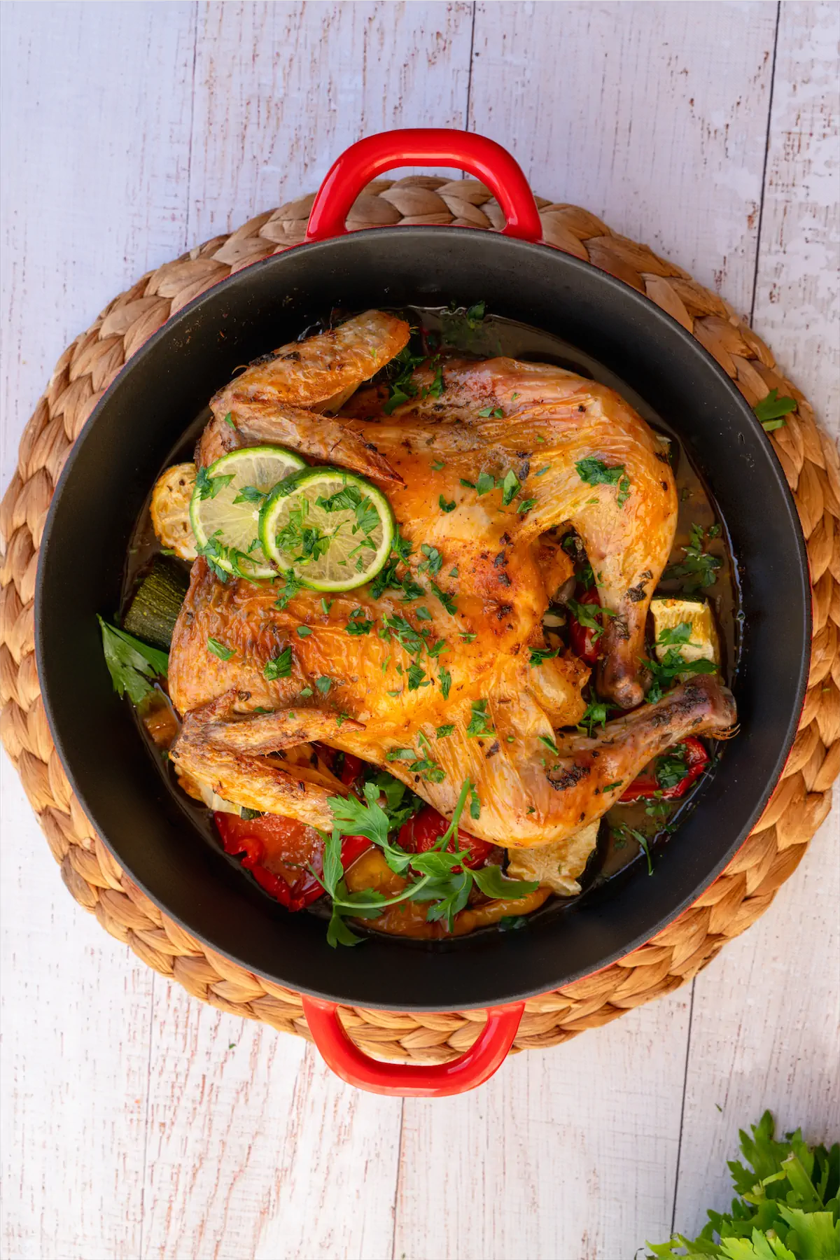 Whole chicken recipe in a cast iron pot.