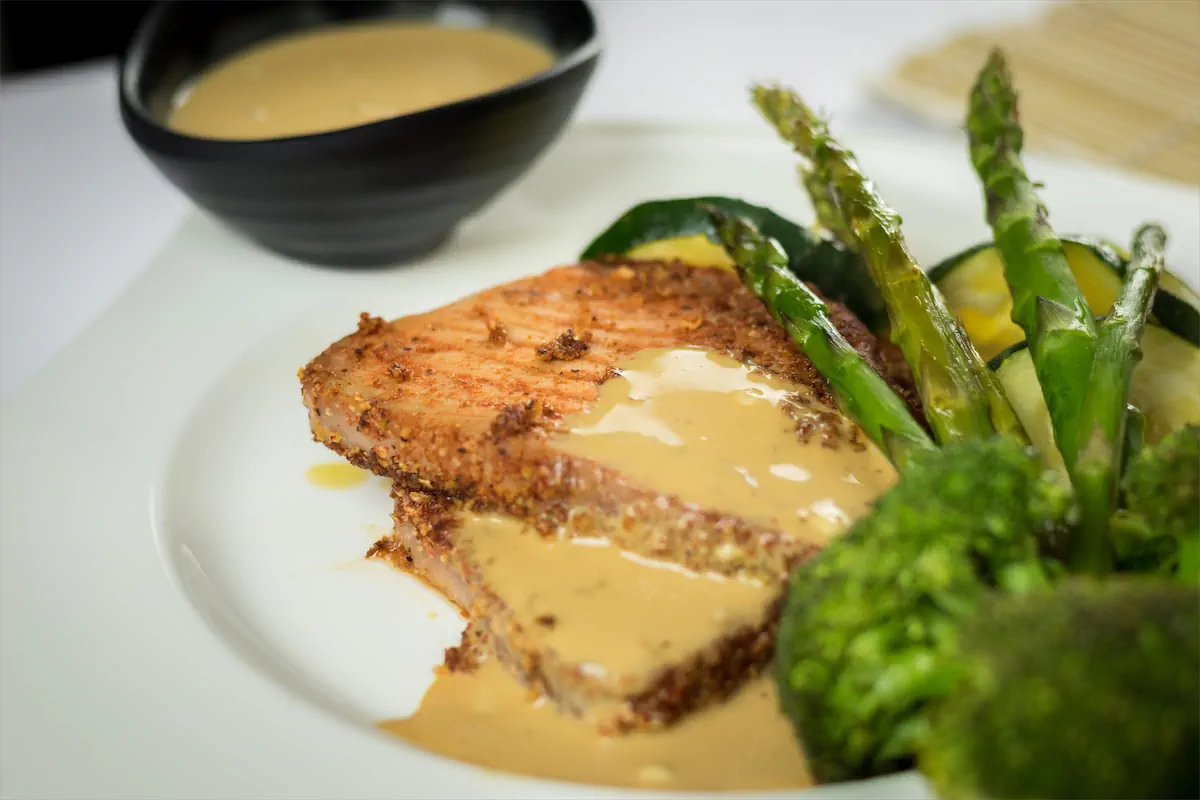 Keto tuna steak recipe with vegetables and wasabi sauce.