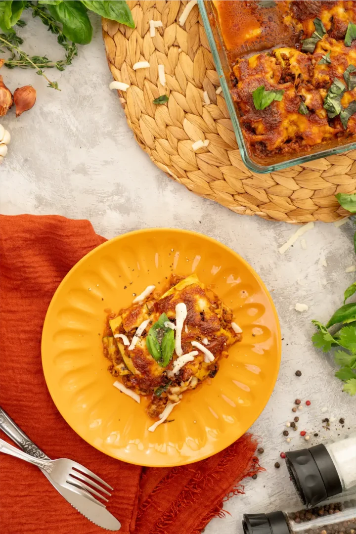 Lasagna topped with cheese.