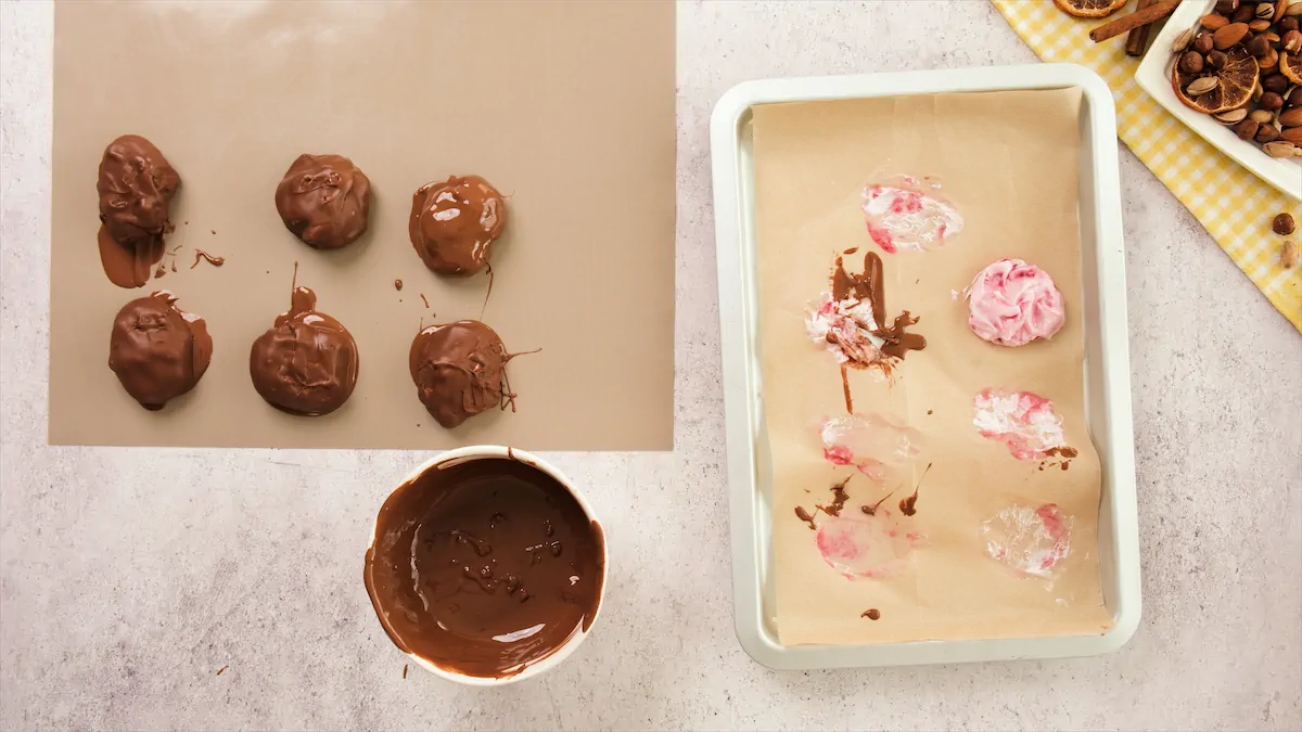 Frozen yogurt bites are getting coated with melted chocolate.