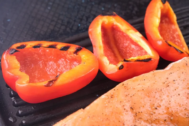 Half grilled red bell peppers.