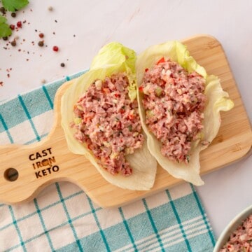 Old fashioned ham salad served on lettuce wraps and presented on a wooden board.
