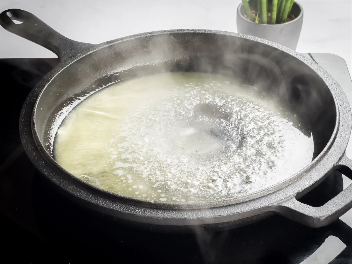 Heating olive oil and butter in the cast iron skillet.