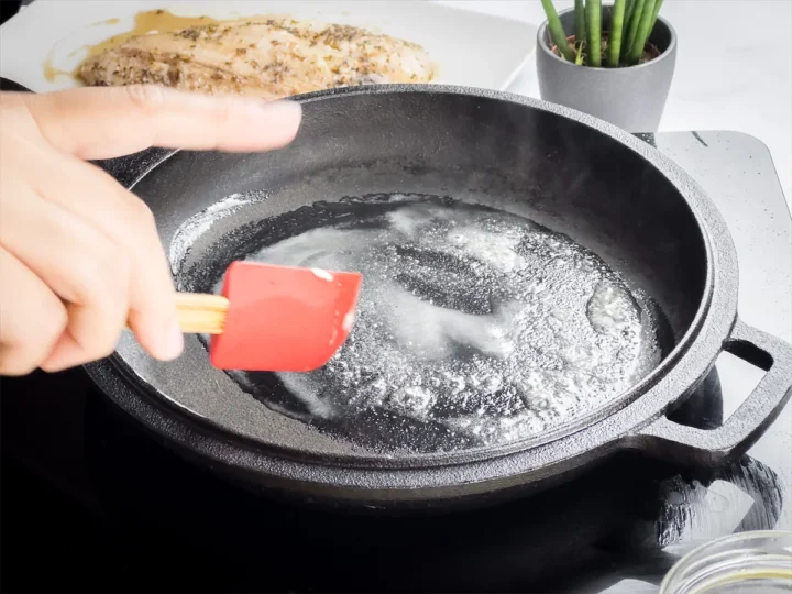 Melting butter in a cast iron skillet.