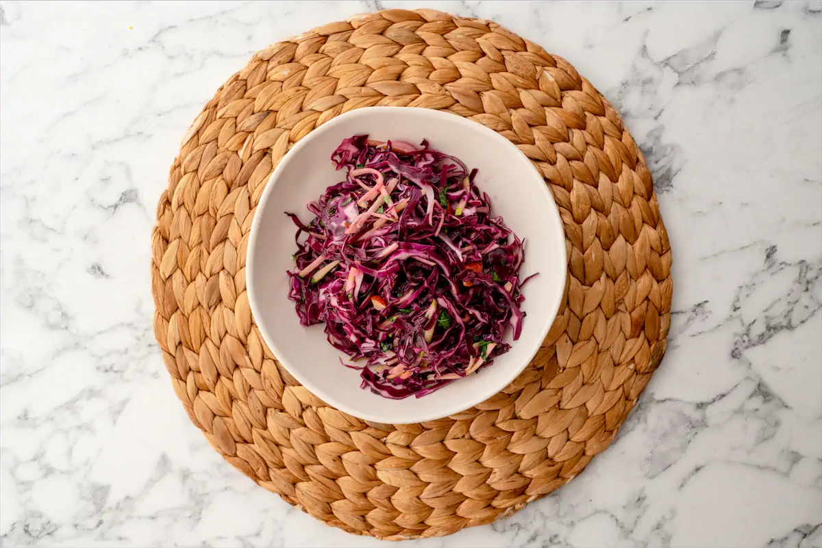 Keto red cabbage salad recipe served in a bowl.