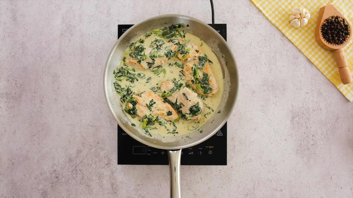 Chicken filets cookings with the creamy spinach based gravy of chicken Florentine.