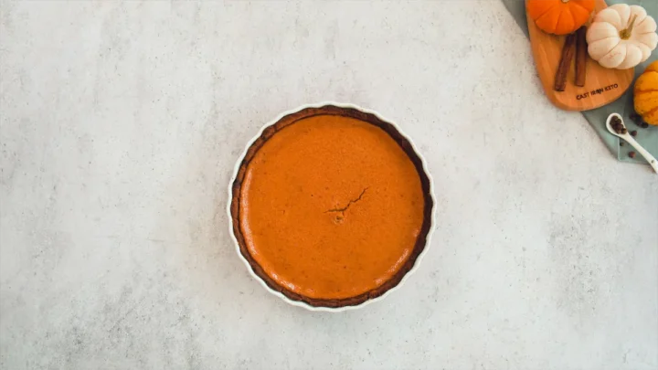 Baked keto pumpkin pie in a pie dish.