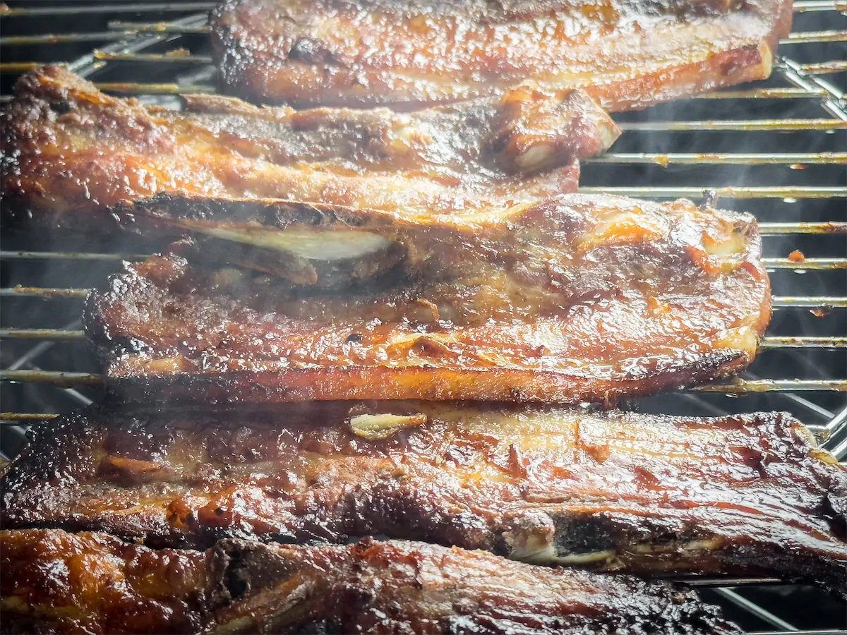 Pork ribs cooking in the smoker.