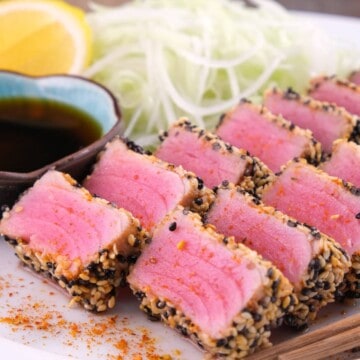 Sliced keto ahi tuna steak recipe with a crispy sesame crust and ponzu sauce.