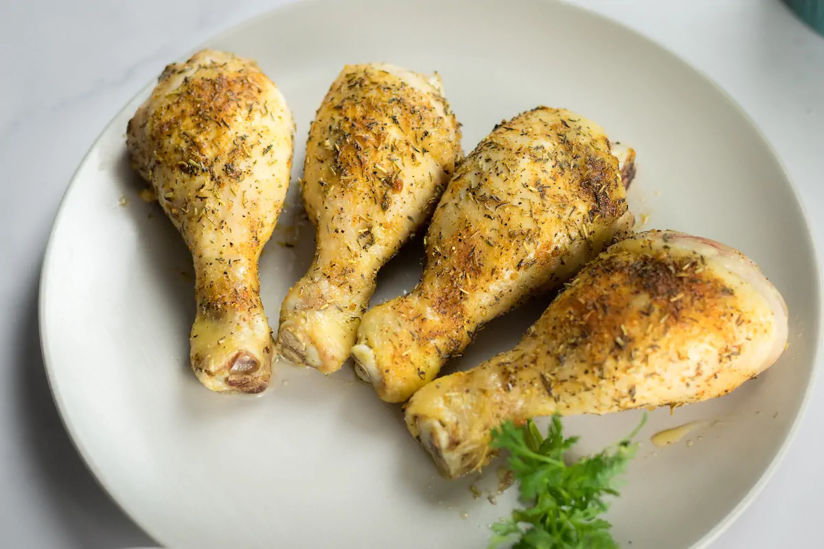 Keto baked chicken legs with a delightful spice blend, served on a plate.