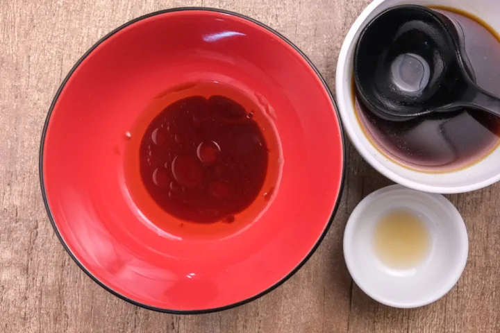 Making keto shoyu tare and sesame oil for the ramen bowl.