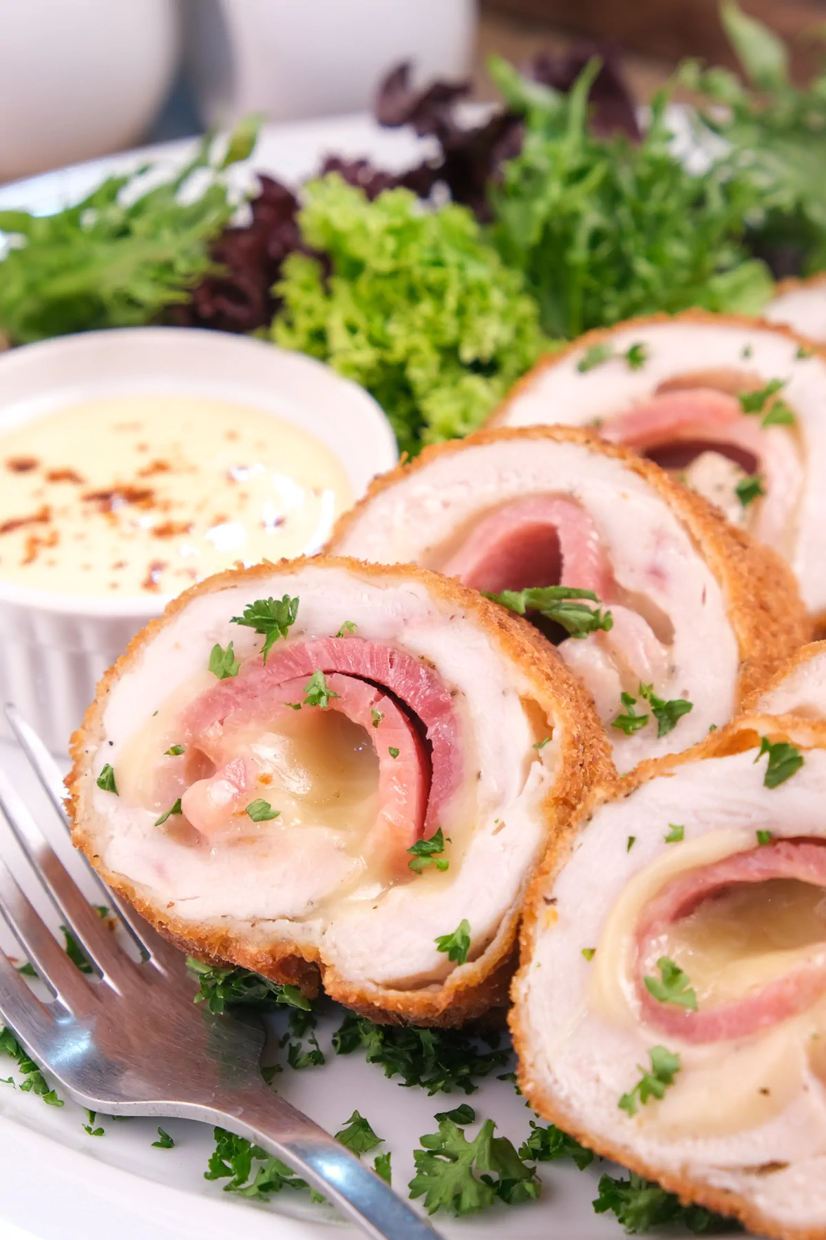 Low-carb chicken cordon bleu sliced revealing the layers inside.