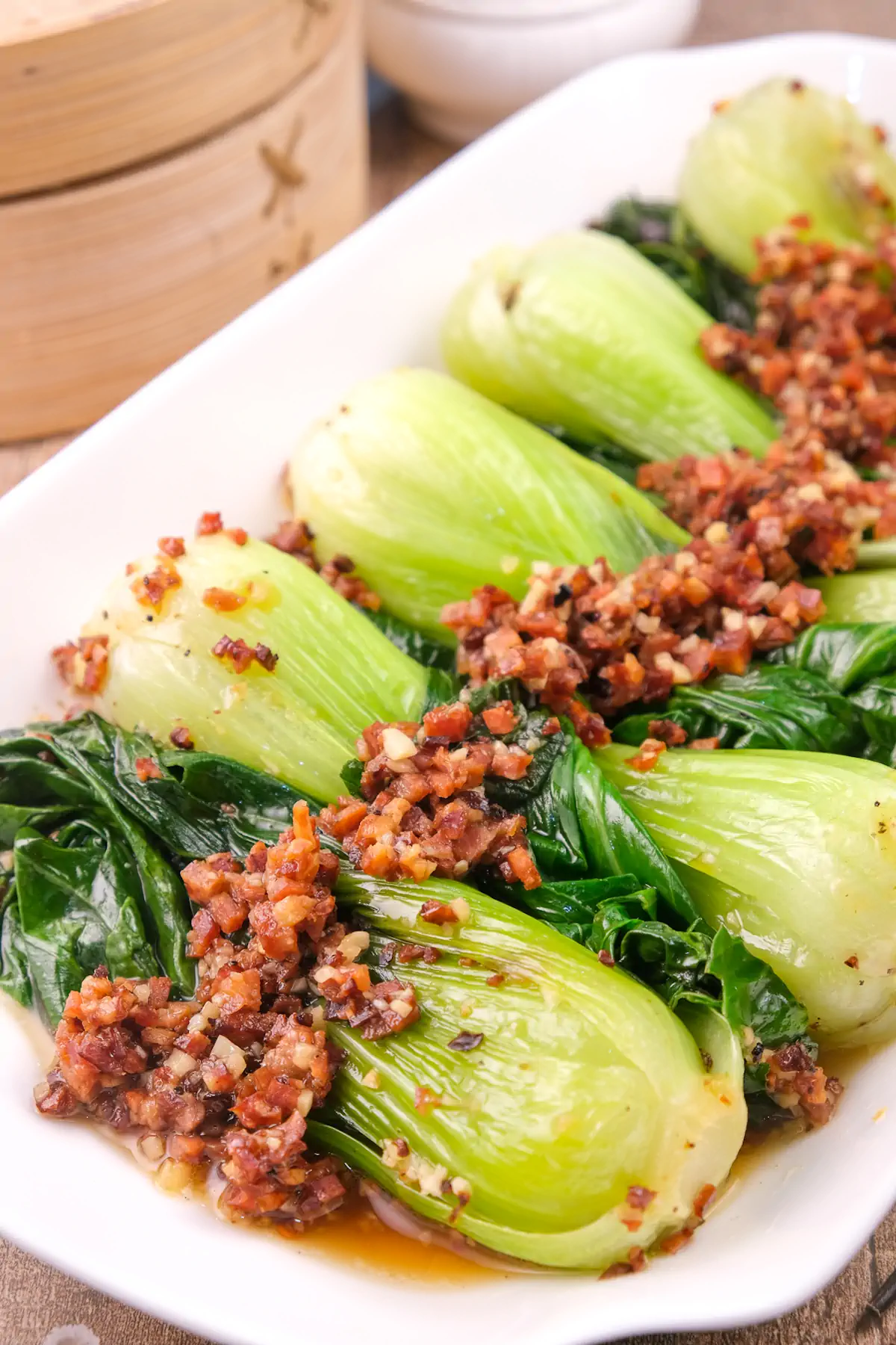 Homemade chorizo and Chinese keto bok choy on a rectangular serving dish.