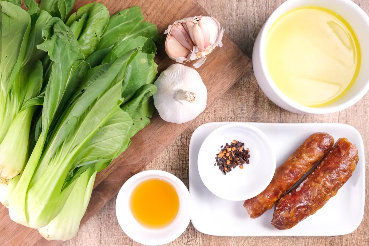 All the ingredients required to make keto bok choy arranged and displayed on the table.