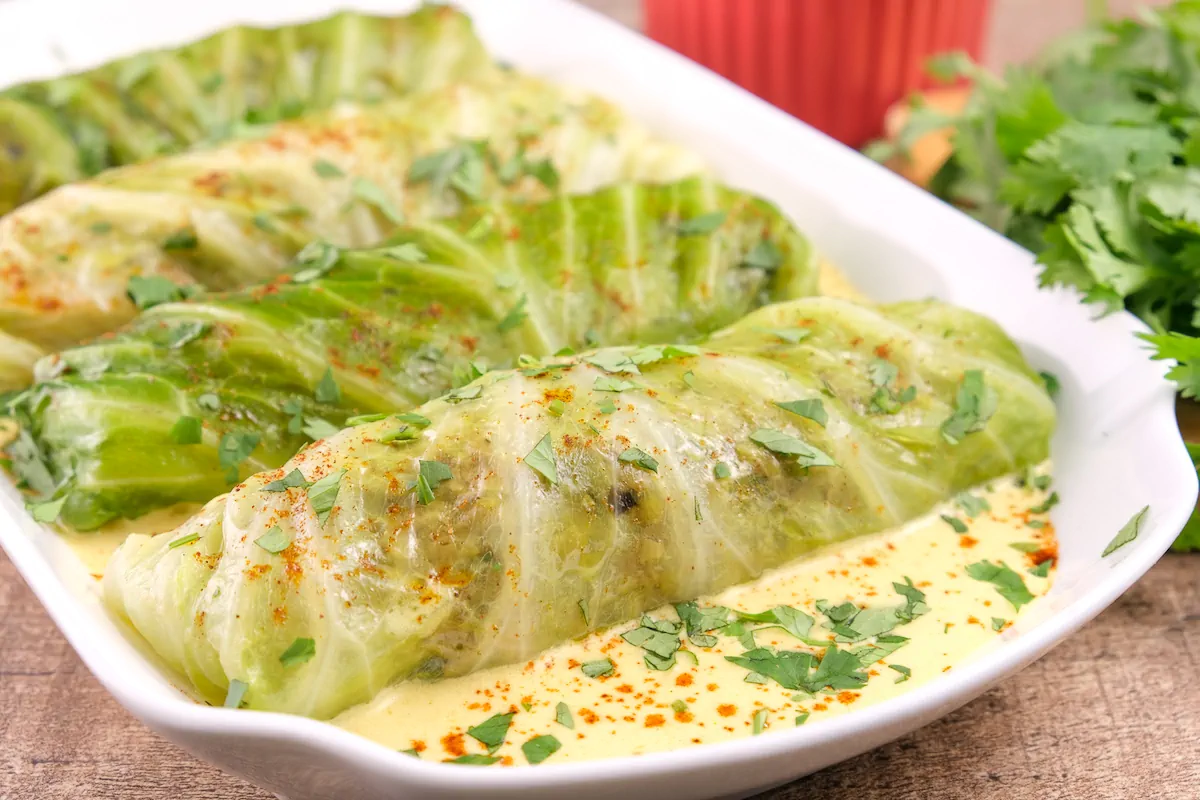 Homemade keto cabbage rolls with Indian-inspired curry gravy.