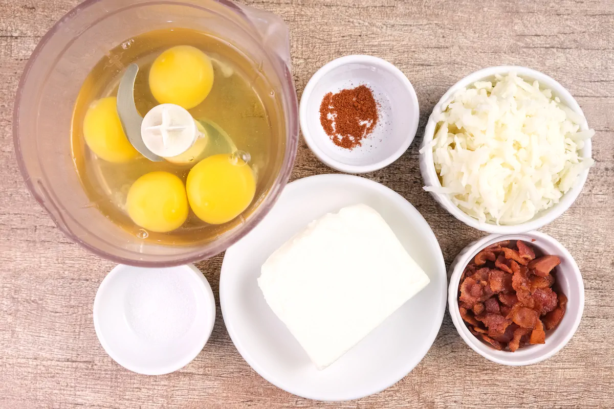 All the ingredients required to make Starbucks egg bites gathered and arranged on the table.