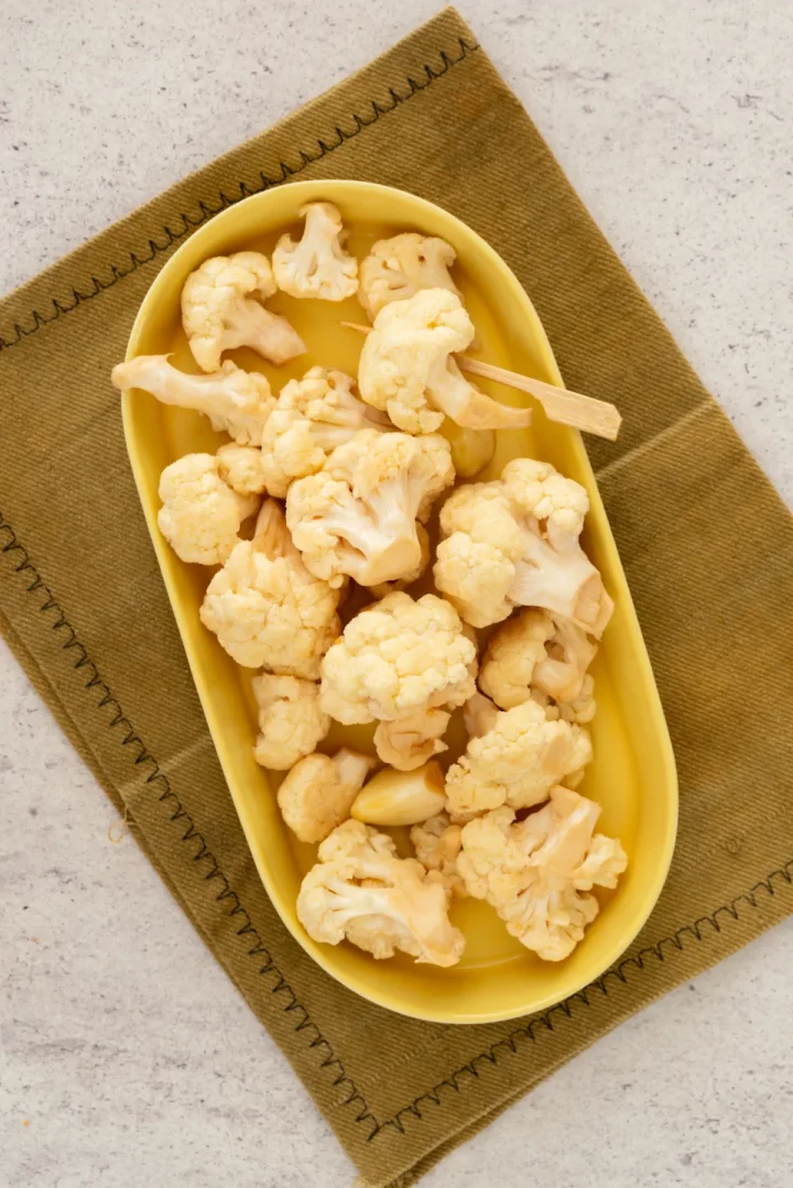 Homemade cauliflower pickles served on a plate.