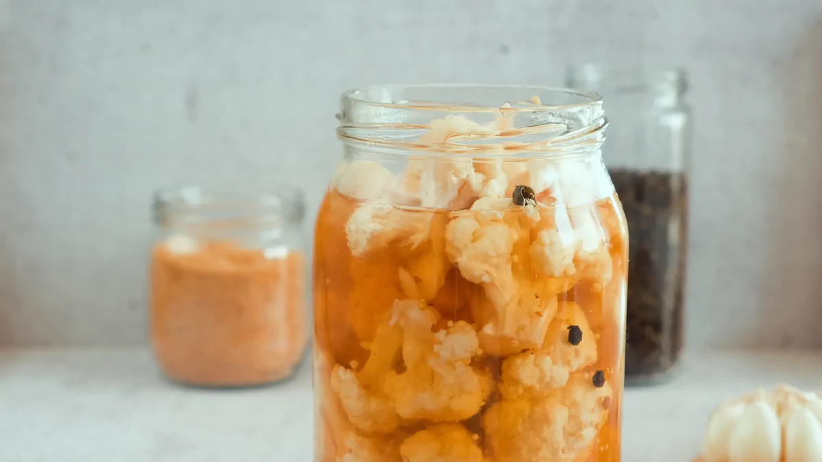 A glass jar with cauliflower pickles.