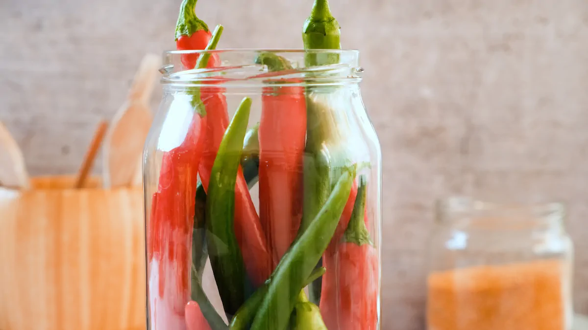 Peppers arranged in a jar ready to pour the brine.
