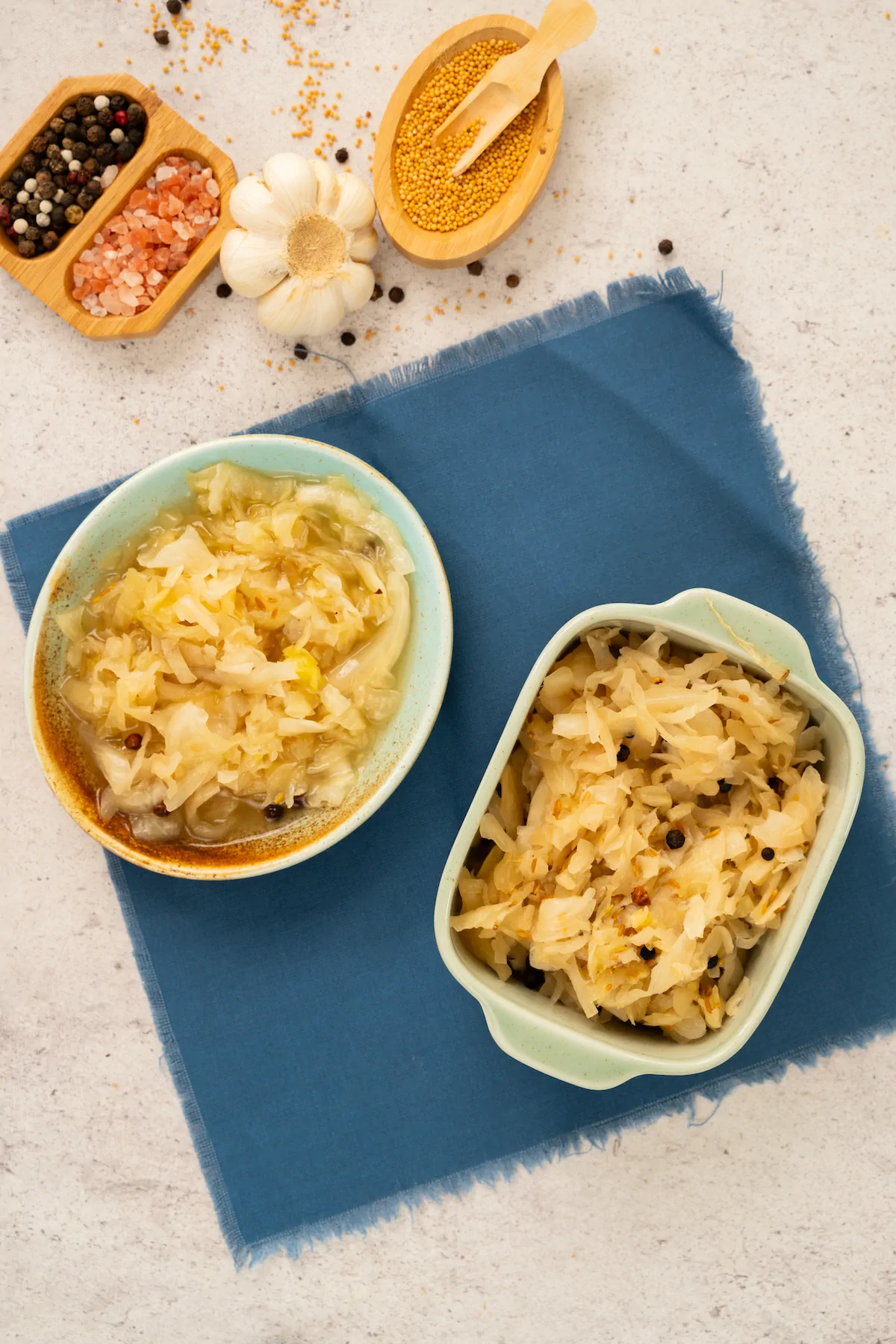 Homemade tangy sauerkraut served in the ceramic bowls.