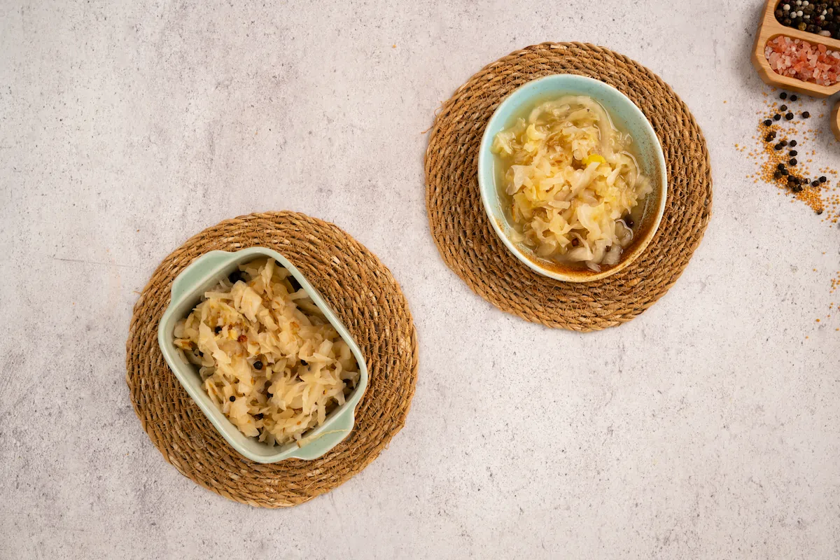 Homemade sauerkraut served in ceramic bowls.