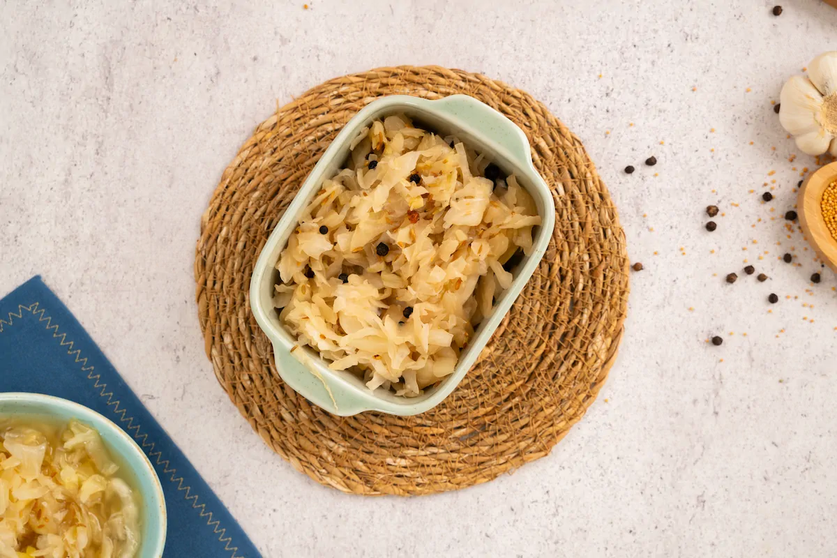 Crunchy and tangy sauerkraut served in a ceramic bowl.