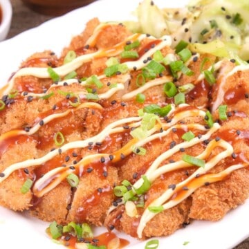 Japanese mayo and katsu sauce on slices of fried chicken fillets.