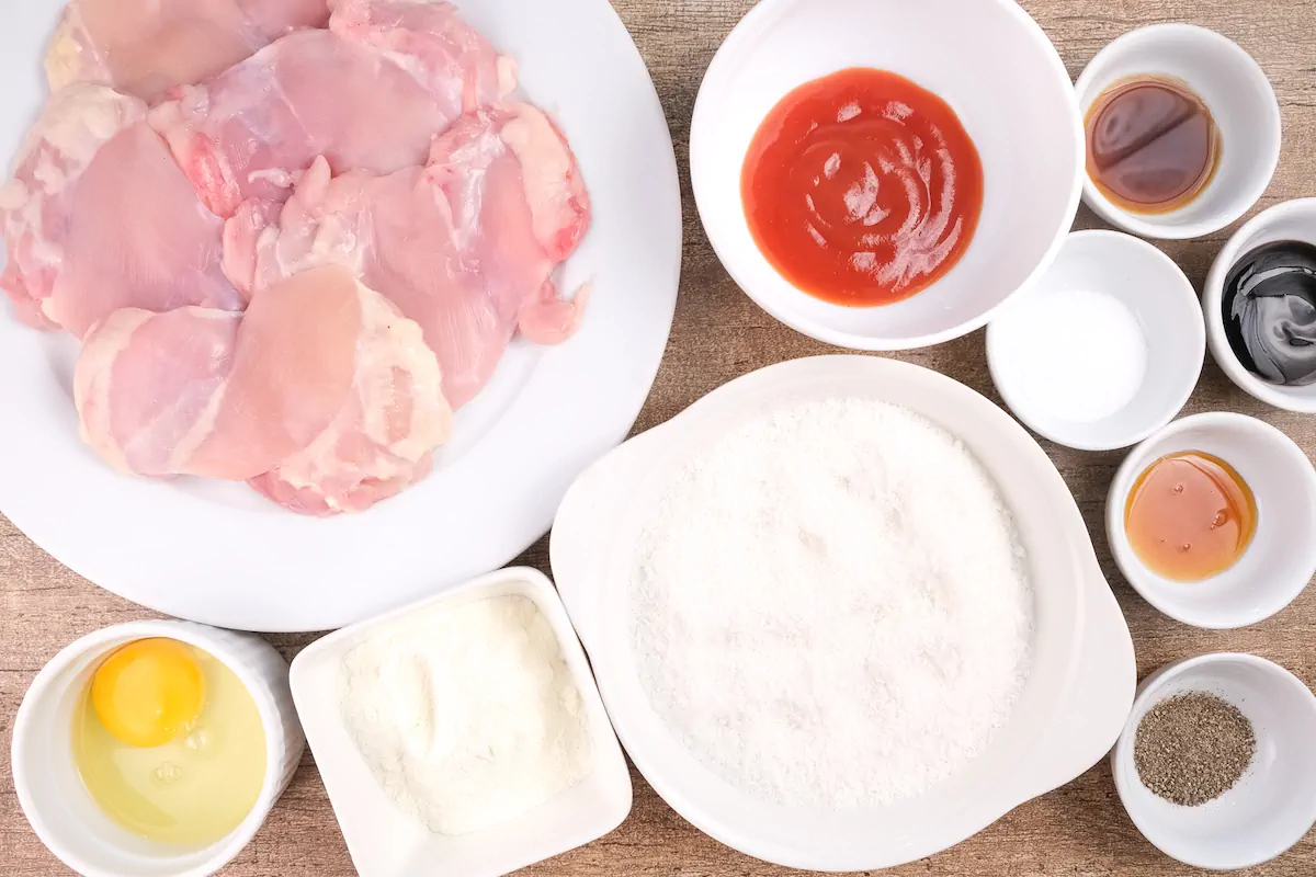 All the ingredients required to make the chicken katsu are gathered and arranged on the table.