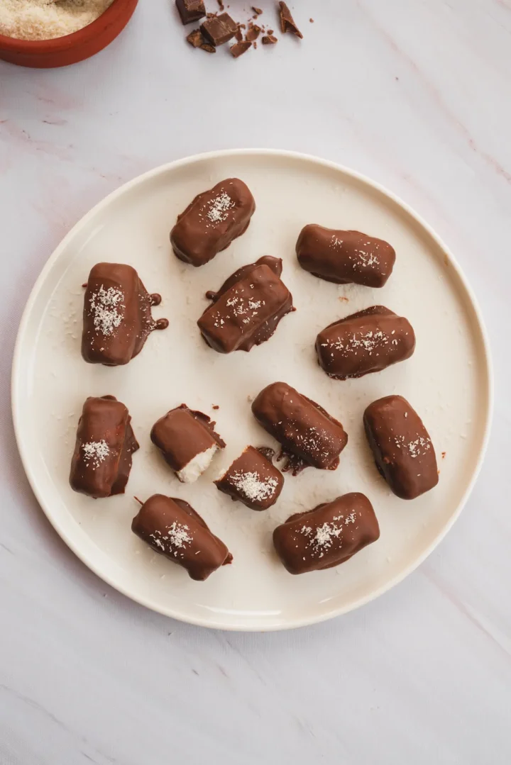 Keto bounty bars are presented on a white plate.
