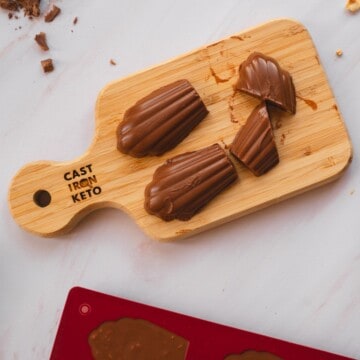 Keto chocolate fudges presented on a wooden board.