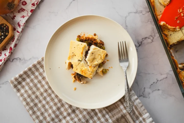 Low-carb cottage pie served in a white plate.