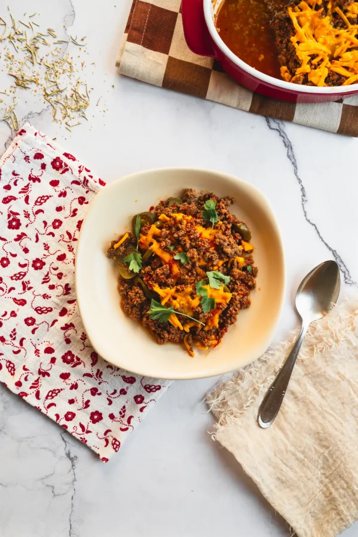 Low-carb keto Tex-Mex casserole presented in a bowl with a spoon.