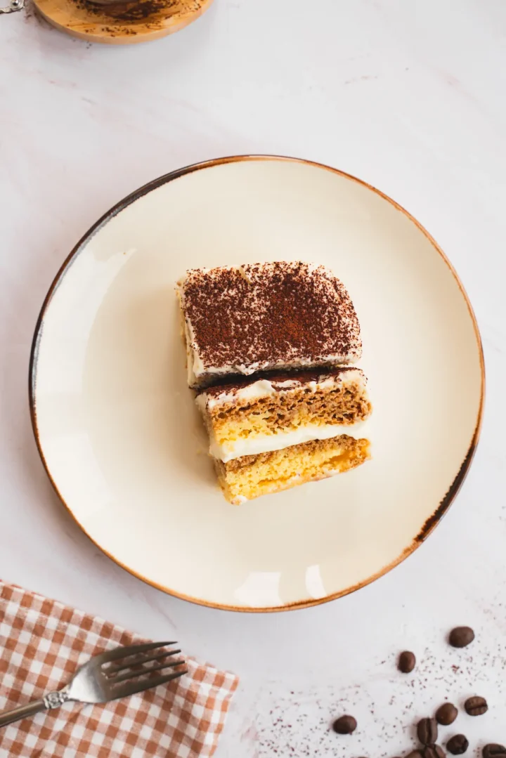 Keto tiramisu is presented on a plate showing it's layers.