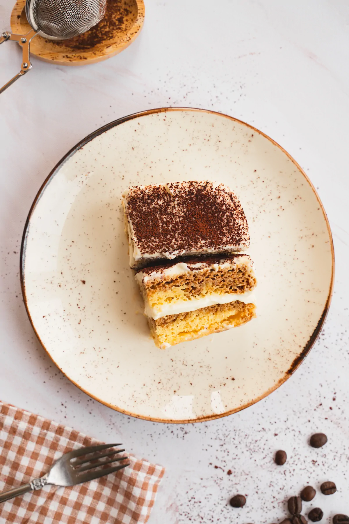 Keto tiramisu served on a plate, displaying its layers.
