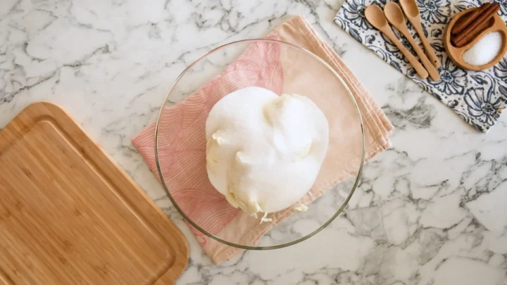 Softened cream cheese and monk fruit sweetener in a mixing bowl.